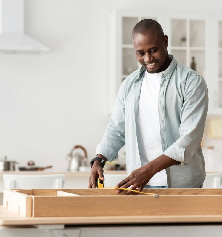 handyman-working-at-home-repairing-assembling-and-renovation-or-new-hobby-man-measuring-new-table.jpg